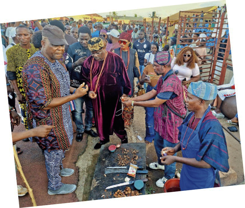 Akinboboye (left) and other guests moving round to taste the Asun delicacy