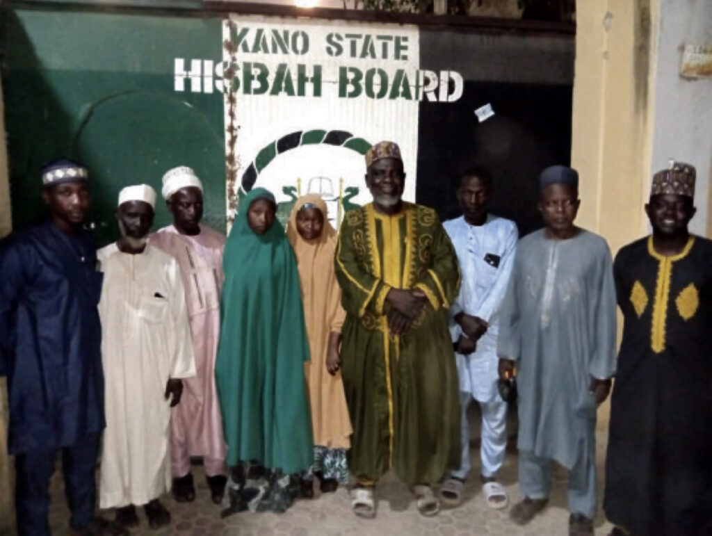 Jinkai (in brown hijab) with officials of Kano Hisbah