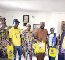 Lions Club members with the monarch and his chiefs