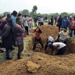 Mourners digging grave for mass burial of victims of May 5 attack in Nding Sesut village of Fan district, Barkin Ladi before they were attacked