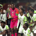 Super Eagles Captain Francis Ozoho receives the Unity Cup