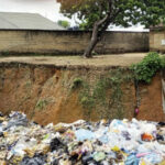 The gully encroaching on the Federal Housing Estate, Aba, Abia State