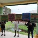 The various placards bore by the protesters