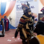 Arondizuogu masquerader entertaining the participants at the lecture.