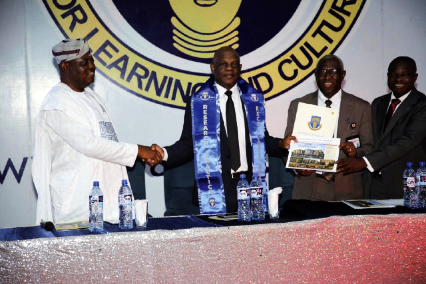 Echono in a handshake with officials of OAU after he delivered at the 65th anniversary celebration of Obafemi Awolowo University (OAU), Ile-Ife.