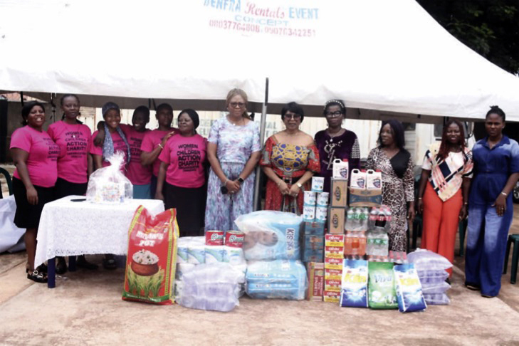 Founder and CEO of WACCA presenting gift items to vulnerable children at FSP Children’s Home, Enugu