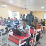 Dr Aminu Mohammed, Registrar, NABTEB (Standing) during the monitoring exercise at the college