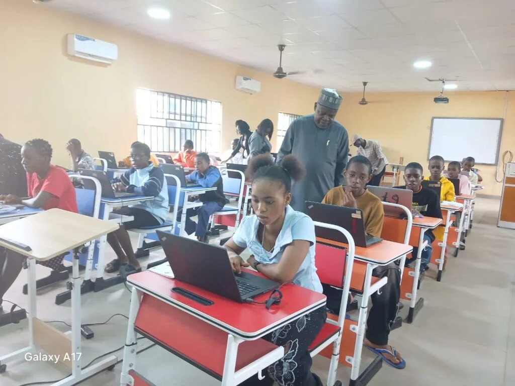 Dr Aminu Mohammed, Registrar, NABTEB (Standing) during the monitoring exercise at the college