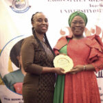 Lafiaji-Okuneye presenting plague to Akin-Olugbemi