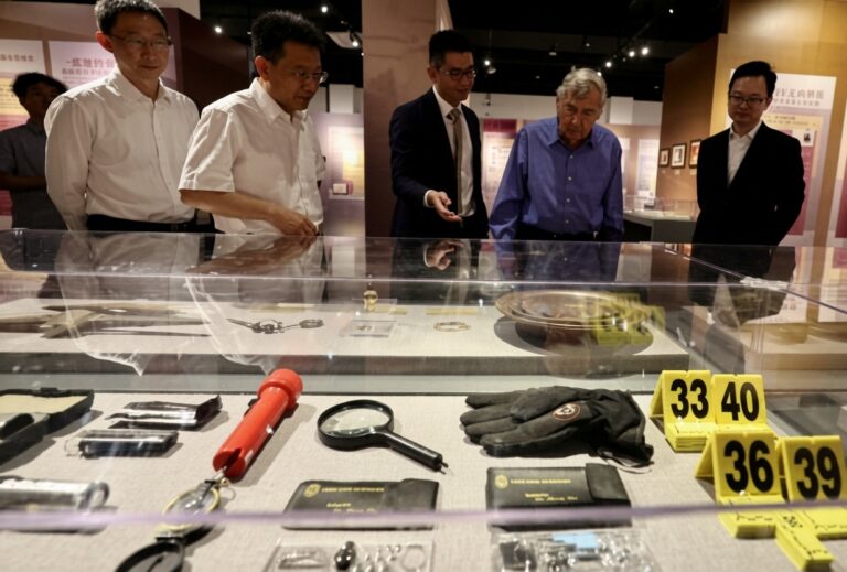 A renowned American Scholar and Founding Dean of Harvard University's Kennedy School of Government, Professor Graham Allison (2nd r), during his visit to the special exhibition "Tales of People-to-People Bonds Between China and the United States" in Beijing, on June 27, 2026. [Photo by Zhang Wei/chinadaily.com.cn]