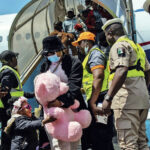 Returnees diesmbarking from the flight from South Africa at the MMIA, Ikeja, Lagos
