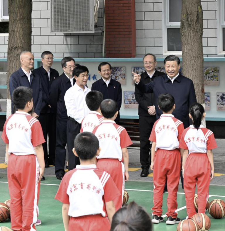 Chinese President Xi Jinping, also general secretary of the Communist Party of China Central Committee and chairman of the Central Military Commission, talks with students on the basketball court of Beijing Yuying School in Beijing, May 31, 2023. /Xinhua