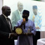 UniAbuja VC presenting an award to Echono