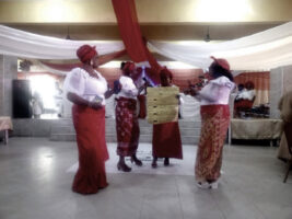 Women groups recite Voices of Motherhood during the programme