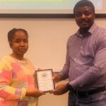 Clare Nnachor receiving her award