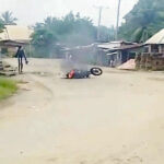 •A motorcycle on fire during the incident.
