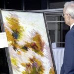 A diplomat appreciating one of the works