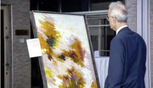 A diplomat appreciating one of the works