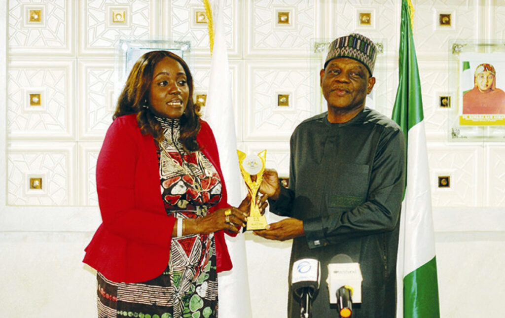 FAN chairman, Ene Agada, presenting a recognition award to TETFund Executive Secretary, Sonny Echono, during the visit.