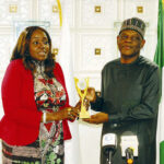 FAN chairman, Ene Agada, presenting a recognition award to TETFund Executive Secretary, Sonny Echono, during the visit.