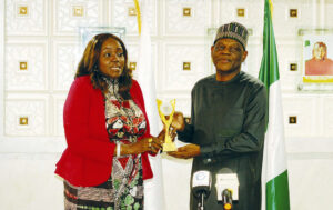 FAN chairman, Ene Agada, presenting a recognition award to TETFund Executive Secretary, Sonny Echono, during the visit.