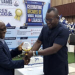 Prof. Ozoemene receiving an award from HOD, Prof. Austin Nwagbara