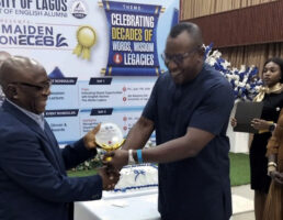 Prof. Ozoemene receiving an award from HOD, Prof. Austin Nwagbara