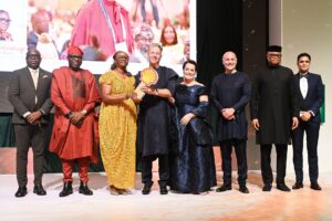 Marno de Jong officially hands over to Elohor Aiboni as Executive Vice President, Nigeria, and Country Chair, Shell Companies in Nigeria (SCiN), as industry leaders look on during the handover ceremony at Eko Hotel & Suites, Lagos