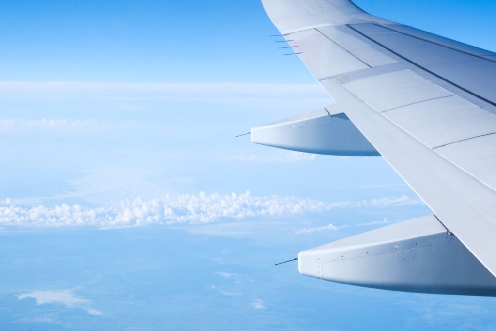 TAL-plane-over-clouds-FLY35KFT-862a180619f046aea1275ca294fa9116