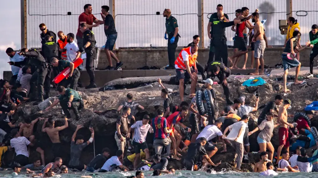 Thousands of migrants cross from Morocco into Spain’s Ceuta enclave