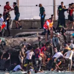 Thousands of migrants cross from Morocco into Spain’s Ceuta enclave