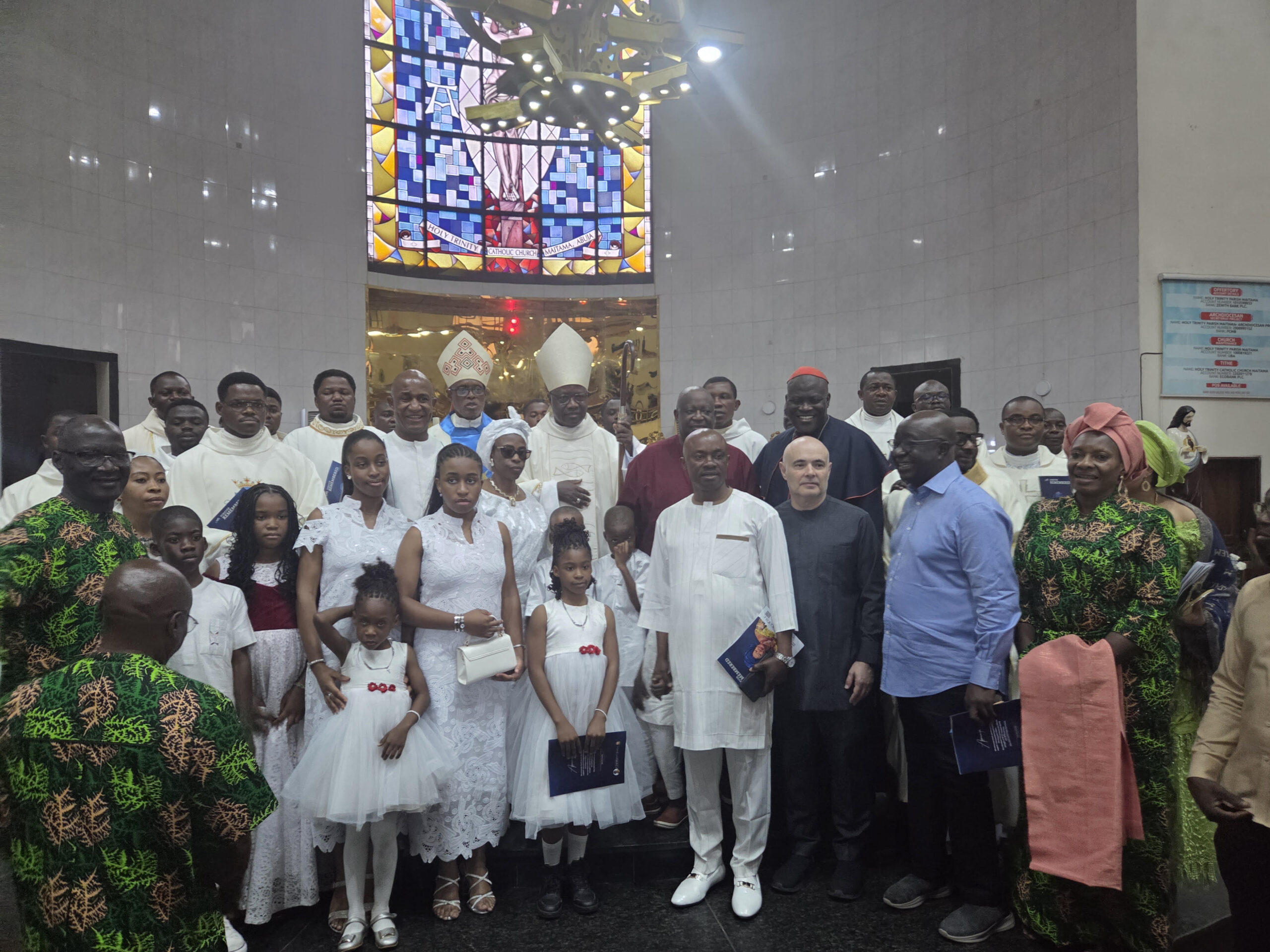 Front Roll: The Immediate Past Minister of Women Affairs, Dame Pauline Tallen (r), the Deputy Governor of Nasarawa State, Dr Emmanuel Akabe (2nd r); the Israeli Ambassador to Nigeria, Michael Freeman (3rd r).  Back Roll: The Catholic Archbishop of Abuja, Most Revd (Dr) Ignatius Kaigama (m), the Auxiliary Bishop of Abuja, Most Revd Anselm Umoren (5th l), son of the deceased, Professor John Kennedy Opara (4th l), the members of the Opara family and other dignitaries who attended the Requiem Mass in honour of Mama Ezinne Christiana Opara, mother of the Chairman, CSS Group of Companies, Professor John Kennedy Opara held at the Holy Trinity Catholic Church, Maitama, Abuja