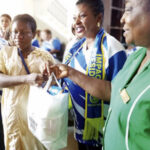 • The President, Chichi Mackings gives out the maternity delivery kits to expectant mothers. She is assisted by Mrs Apex Boika, Head Nursing Services.