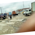 A road being blocked in the industrial estate by containers and trucks