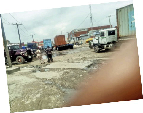 A road being blocked in the industrial estate by containers and trucks