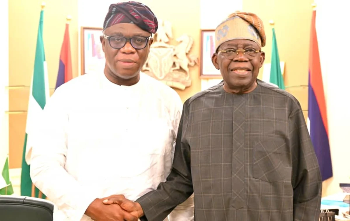 Dr Wole Oluyede(Left) and President Bola Tinubu