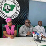 Pastor Cobham, flanked by the NUJ chairman and the permanent secretary information ministry