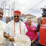Representative of Gov. Solido, Okey Ezeobi, Chief Christopher Ndubisi, and Mayor of Awka South, Prince Chinedu Okafor, during the road inaguration