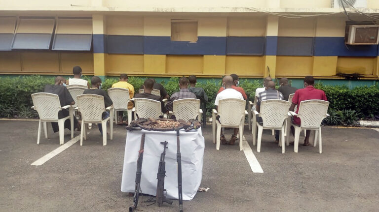 Some of the suspects with their alleged arms and the exhibits