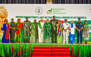 L-R Wife of the Inspector General of Police, Mrs Mutiat Disu, IGP Tunji Disu, Representative of the Wife of the Chief of Army Staff, Mrs Safiyyah Shaibu, Chief of Army Staff, Lt. General Waidi Shaibu, Wife of the Senate President, Mrs Ekaette Akpabio, Wife of the Vice President, Hajia Nana Shettima, First Lady of Nigeria, Senator Oluremi Tinubu, Chief of Defence Staff, General Olufemi Oluyede, his wife, Mrs Mernan Oluyede, Chief of Naval Staff, Vice Admiral Idi Abass, his wife Mrs Aisha Abass, Chief of Air Staff, Air Vice Marshall Aneke and the Wife of the Chief of Staff to the President, Mrs Salamatu Gbajabiamila after the presentation of cheques from the Renewed Hope Initiative by the First Lady held at the State House Banquet Hall Abuja on Thursday 27th August 2026