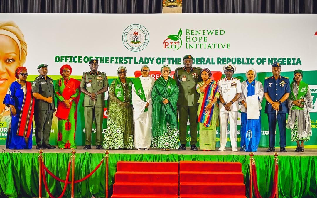 L-R Wife of the Inspector General of Police, Mrs Mutiat Disu, IGP Tunji Disu, Representative of the Wife of the Chief of Army Staff, Mrs Safiyyah Shaibu, Chief of Army Staff, Lt. General Waidi Shaibu, Wife of the Senate President, Mrs Ekaette Akpabio, Wife of the Vice President, Hajia Nana Shettima, First Lady of Nigeria, Senator Oluremi Tinubu, Chief of Defence Staff, General Olufemi Oluyede, his wife, Mrs Mernan Oluyede, Chief of Naval Staff, Vice Admiral Idi Abass, his wife Mrs Aisha Abass, Chief of Air Staff, Air Vice Marshall Aneke and the Wife of the Chief of Staff to the President, Mrs Salamatu Gbajabiamila after the presentation of cheques from the Renewed Hope Initiative by the First Lady held at the State House Banquet Hall Abuja on Thursday 27th August 2026