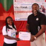 The Deputy National Programmes Manager of VCDF, Mr Philip Ukemezia, presenting Certificate to a participant at Empowerment Training of Nigeria Officers Wives in Delta State