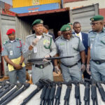 Customs arrests 2 suspects with container loaded with pump-action rifles at Tin Can Port