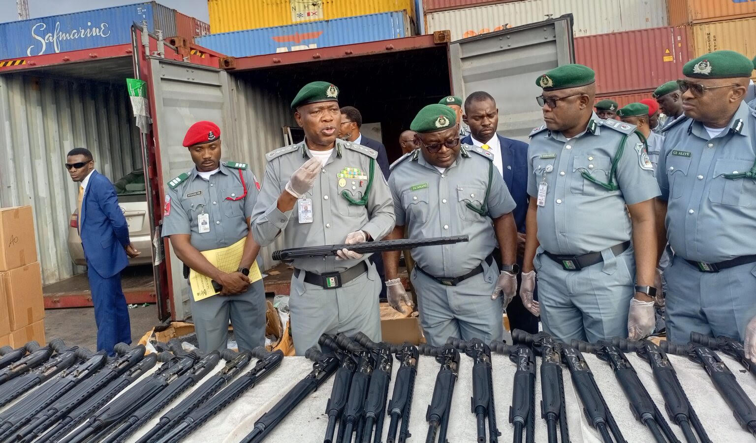 Customs arrests 2 suspects with container loaded with pump-action rifles at Tin Can Port