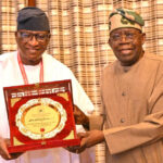 President Bola Tinubu receiving the conferment award of grant patron from National Executive President of Nigeria Union of Petroleum and Natural Gas workers, Comrade Salimon Oladiti at the presidential villa Abuja on Thursday, August 13, 2026