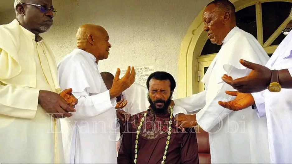 • The senior priests praying for Evangelist Ebuka Obi after his kind gesture.